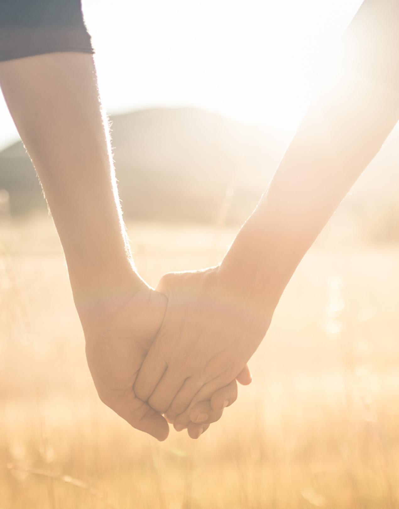 Close up of two hands holding