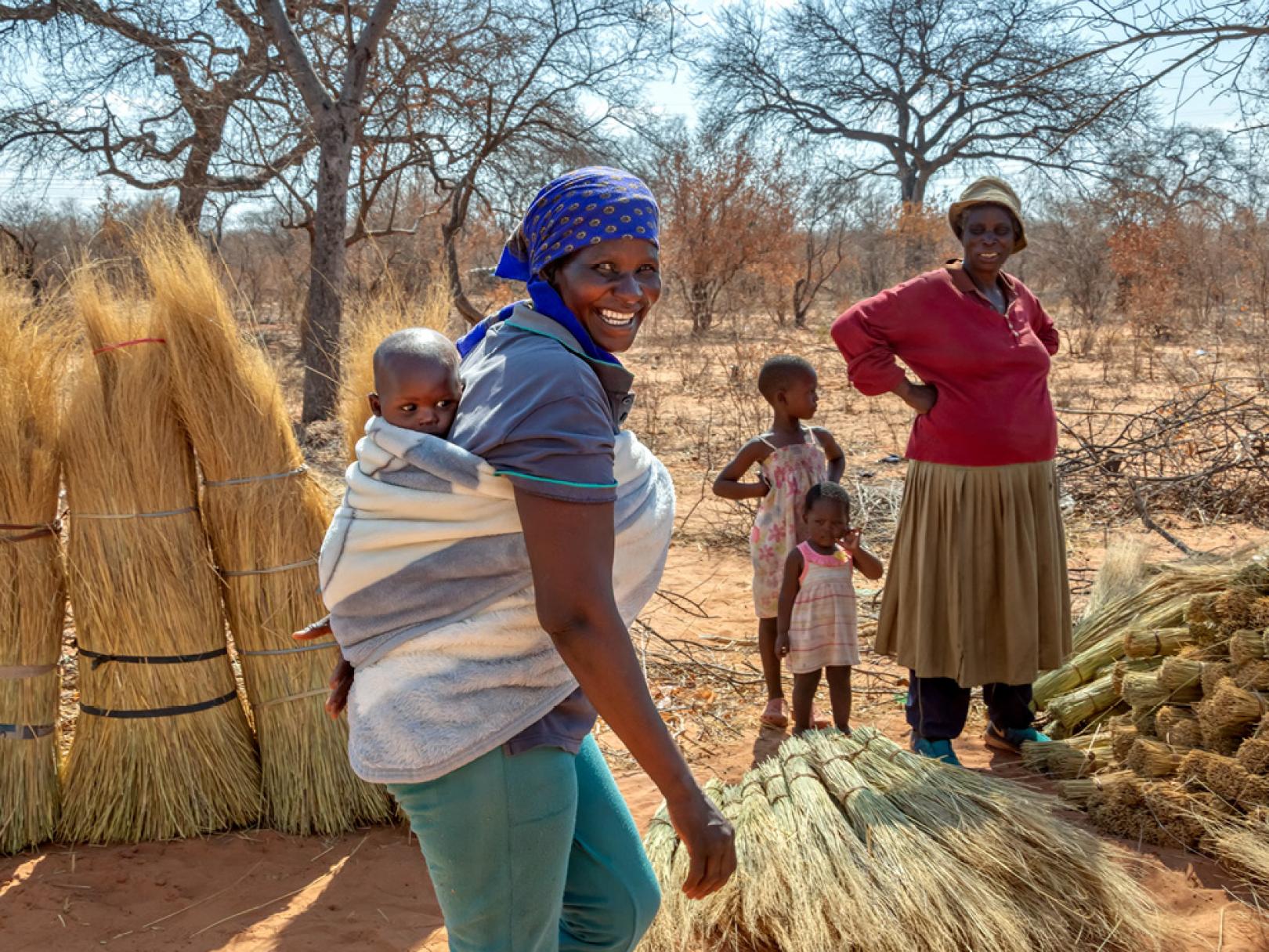 Image of African woman carrying child